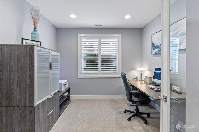 home office with light colored carpet