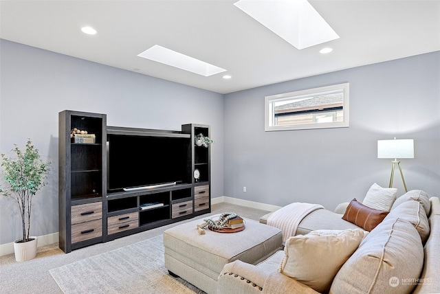 living room featuring a skylight and light colored carpet