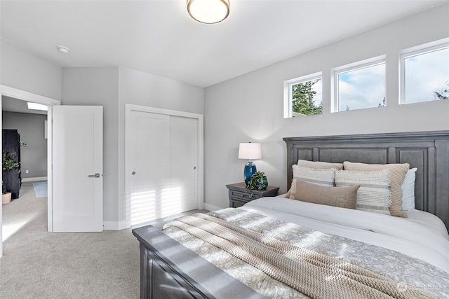 carpeted bedroom with a closet