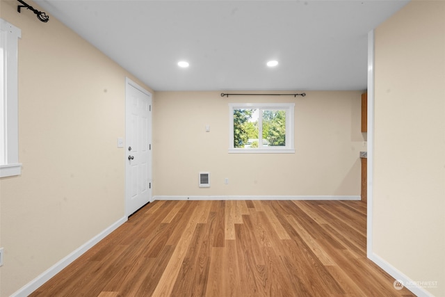 spare room featuring light wood-type flooring