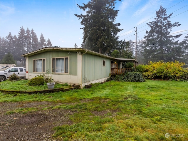 view of property exterior with a yard