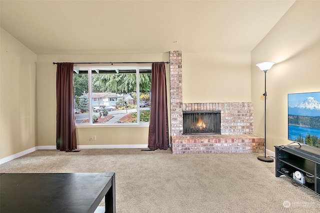 carpeted living room with a fireplace