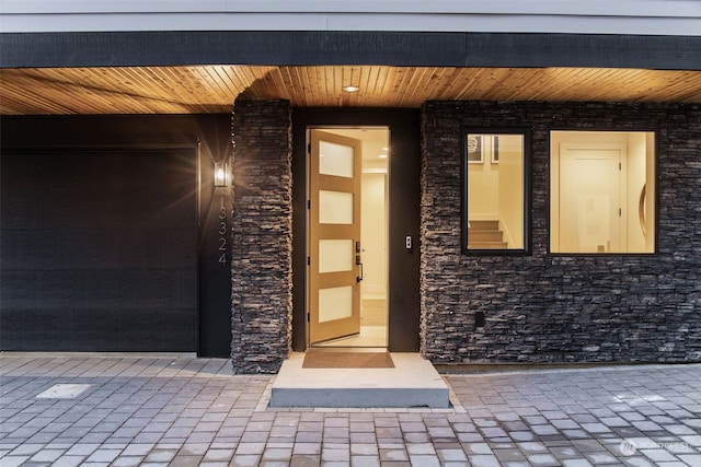 doorway to property featuring a garage