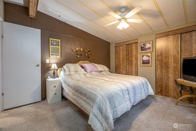 bedroom with ceiling fan, carpet, and vaulted ceiling