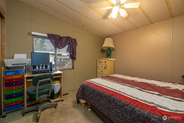 carpeted bedroom featuring ceiling fan and lofted ceiling