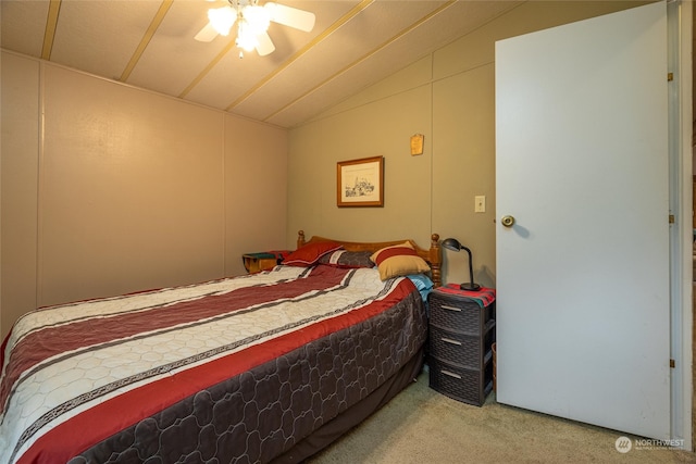 bedroom with carpet flooring, ceiling fan, and vaulted ceiling