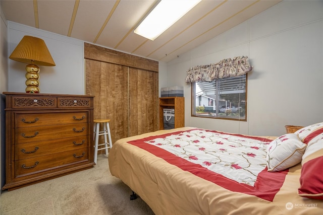 carpeted bedroom with vaulted ceiling