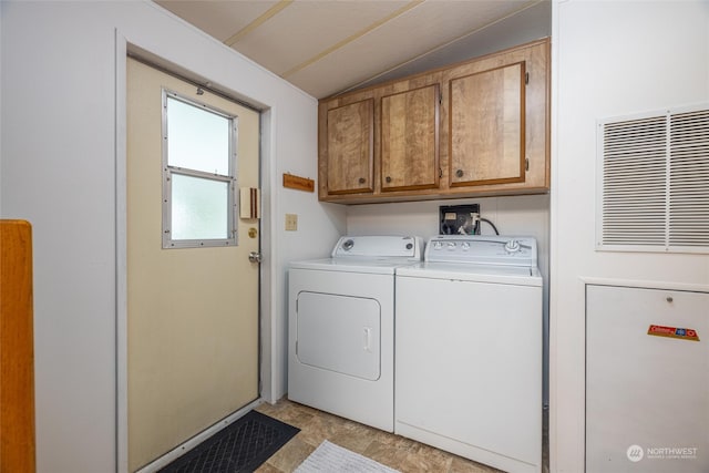 laundry area with cabinets and washer and dryer