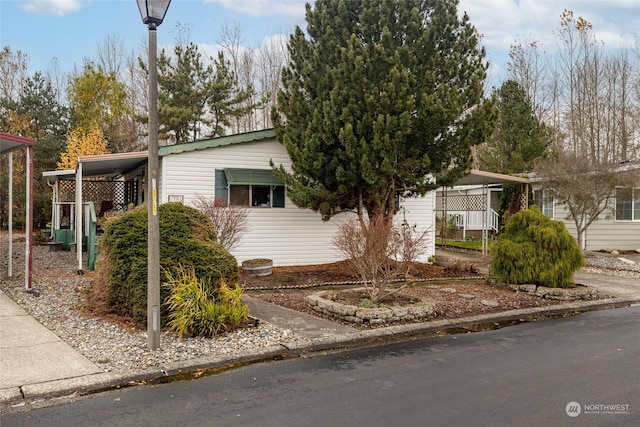 view of front of property featuring a carport