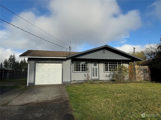 ranch-style home with a front lawn and a garage