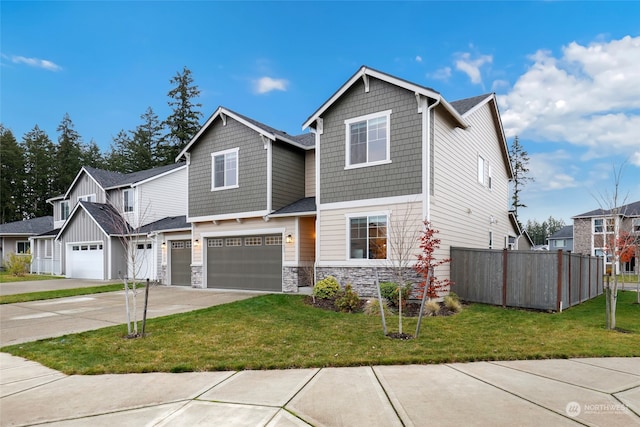 view of front of home with a garage and a front lawn