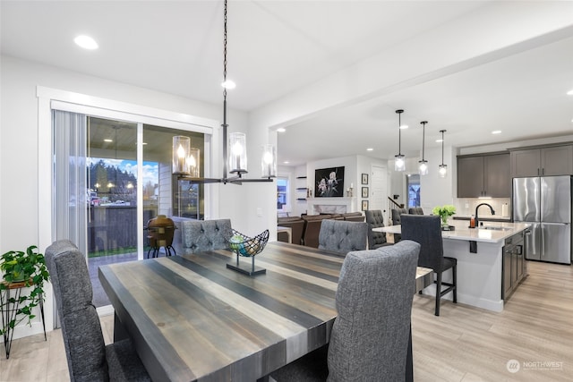 dining room featuring light hardwood / wood-style floors and sink