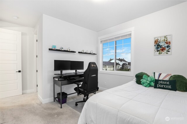 bedroom featuring light colored carpet