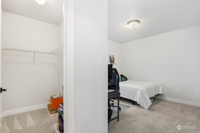 carpeted bedroom featuring a closet