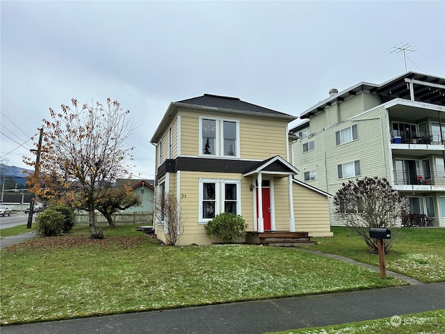 front facade with a front lawn