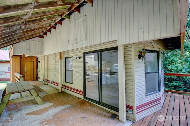 view of side of property featuring a deck