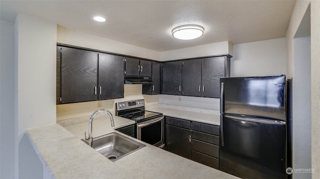 kitchen with black refrigerator, a textured ceiling, sink, and stainless steel electric range