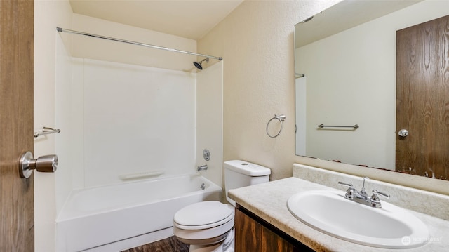 full bathroom with shower / washtub combination, vanity, wood-type flooring, and toilet