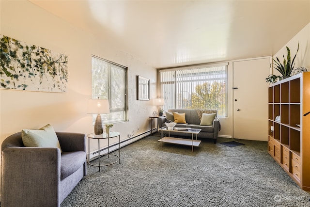 living area with dark colored carpet and a baseboard heating unit