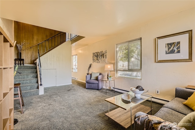 carpeted living room with a baseboard heating unit