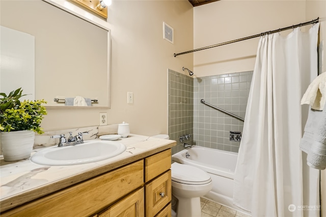 full bathroom with tile patterned flooring, shower / bath combo, toilet, and vanity