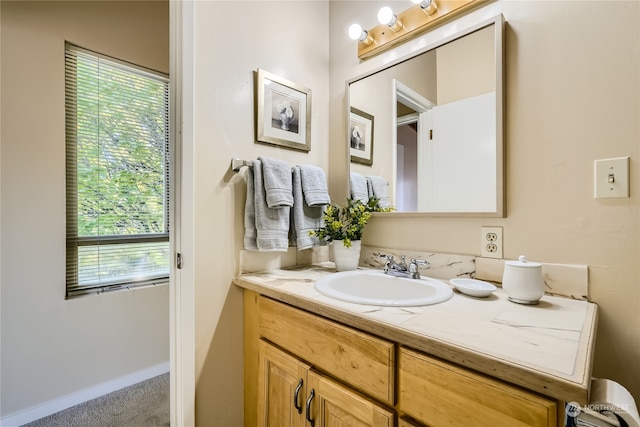 bathroom with vanity and a wealth of natural light