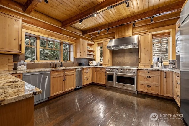 kitchen with wooden ceiling, track lighting, ventilation hood, rustic walls, and appliances with stainless steel finishes