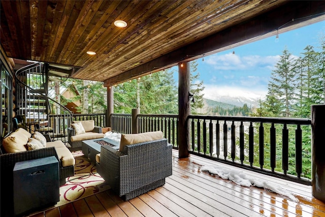 wooden terrace with outdoor lounge area