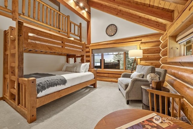 carpeted bedroom with beam ceiling, high vaulted ceiling, rustic walls, and wooden ceiling