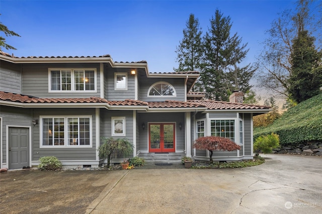 mediterranean / spanish-style house featuring french doors