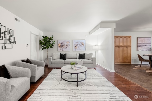 living room with dark hardwood / wood-style floors