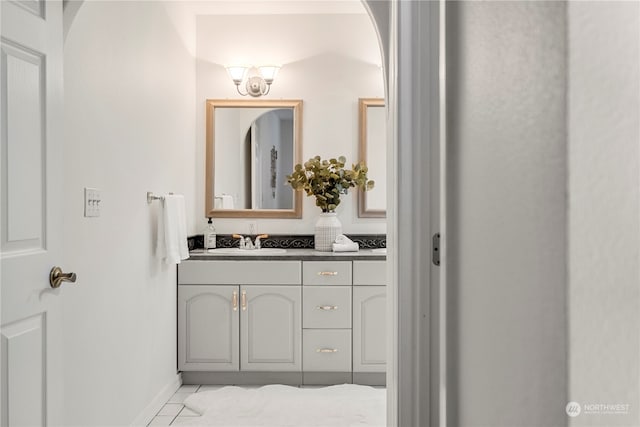 bathroom with tile patterned flooring and vanity