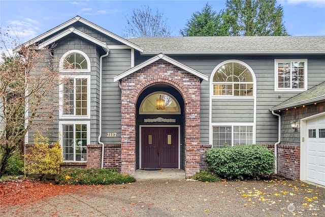 view of exterior entry featuring a garage