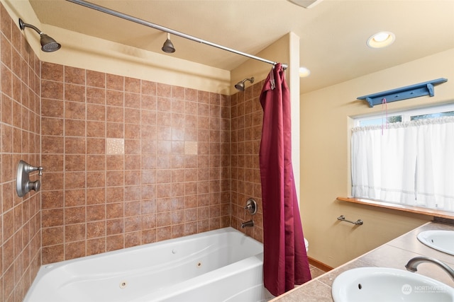 bathroom featuring vanity and shower / bath combination with curtain