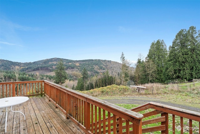 wooden deck with a mountain view