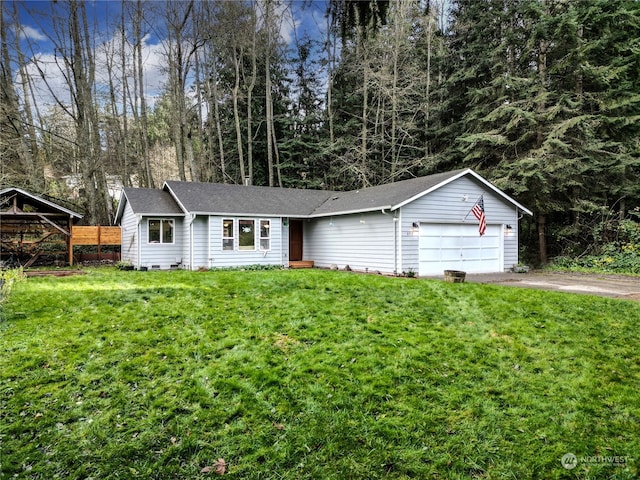 single story home with a garage and a front lawn