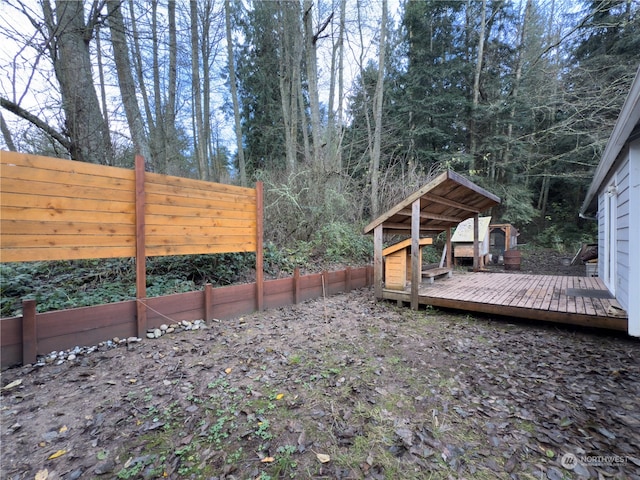 view of yard with a wooden deck