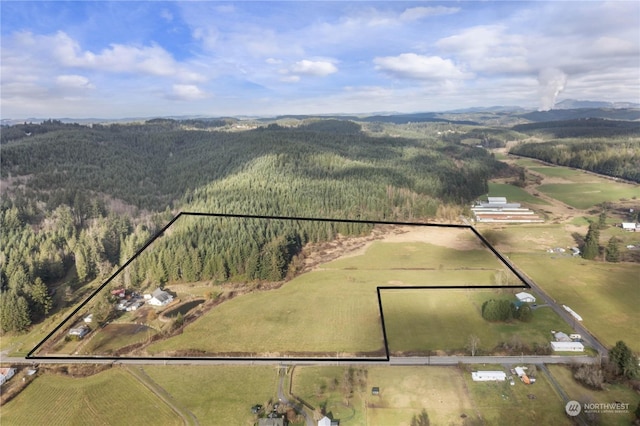2245 Salzer Valley Rd, Centralia, WA 98531 - overview of rural landscape featuring a heavily wooded area, property parcel outlined, and mountains