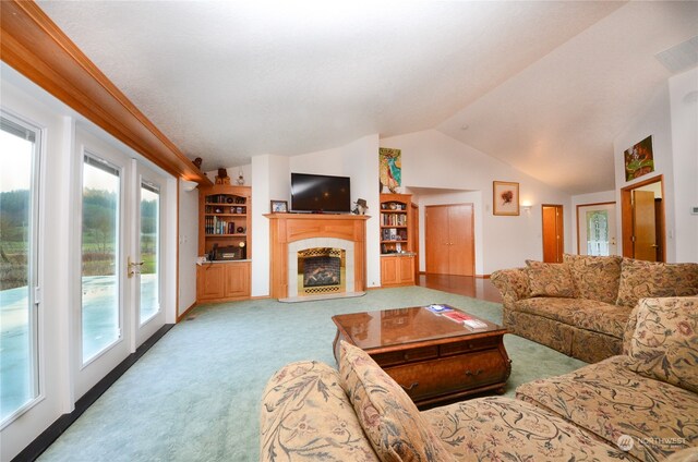 living room with light carpet, french doors, and lofted ceiling