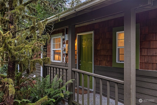 view of side of home with a porch