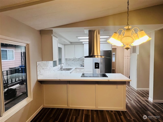 kitchen with kitchen peninsula, decorative light fixtures, island range hood, and white cabinetry