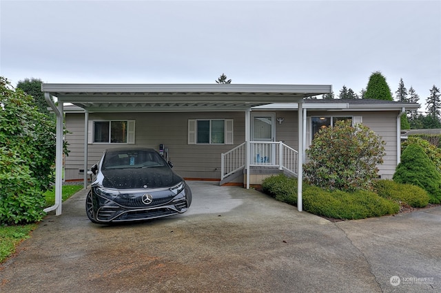 view of front of home featuring a carport