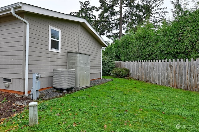 view of yard with central AC