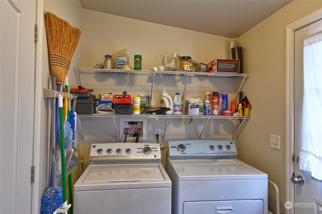 laundry room with washing machine and clothes dryer