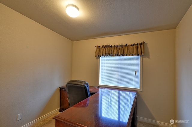 office area with lofted ceiling and a textured ceiling