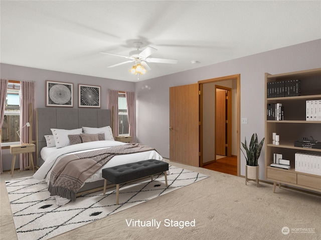 carpeted bedroom featuring ceiling fan