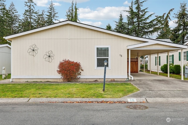 view of property exterior featuring a lawn and a carport