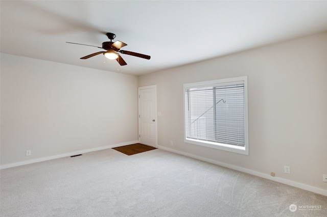 empty room with carpet flooring and ceiling fan