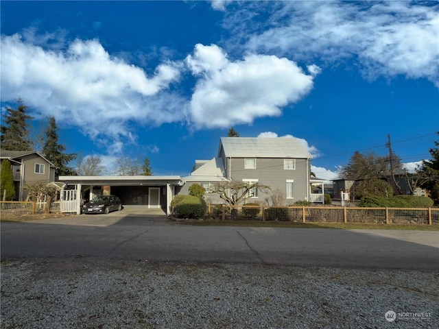 view of front of property with a carport