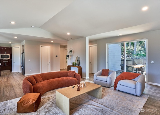 17726 142nd Ave E Unit 9, Puyallup, WA 98374 - living area featuring light wood-style flooring, recessed lighting, lofted ceiling, and baseboards